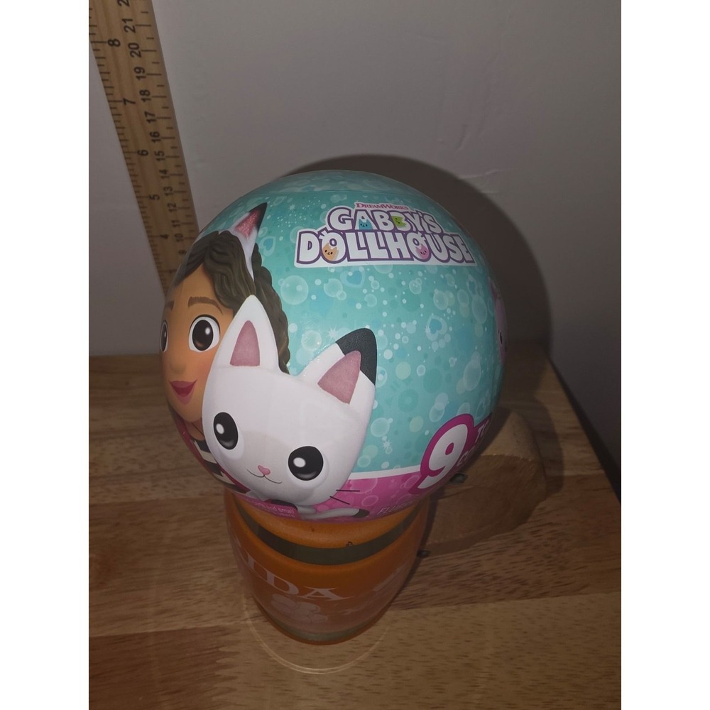 A ZURU 5 Surprise Gabby's Dollhouse Series 1 mystery capsule toy